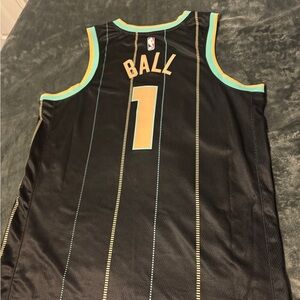 Nike Black Jersey with Gold and Teal Accents